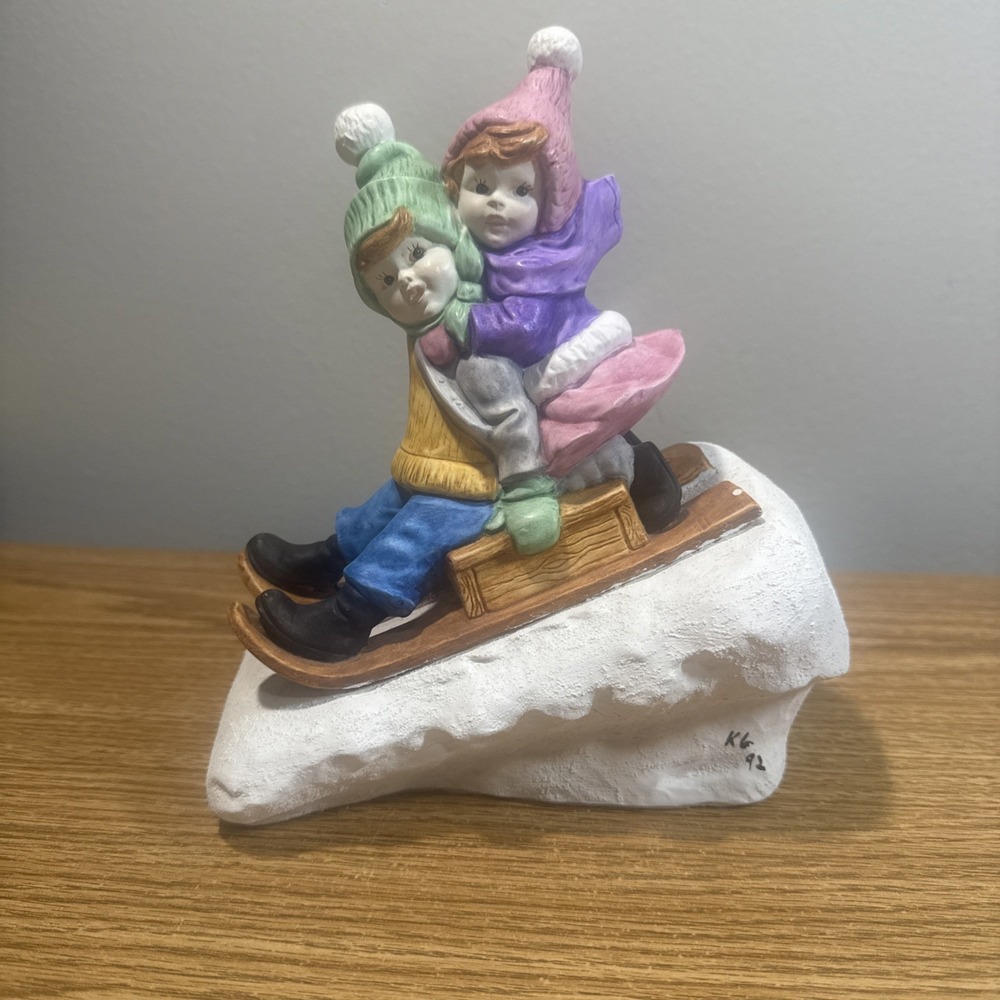 Winter Fun Boy And Girl On Sled